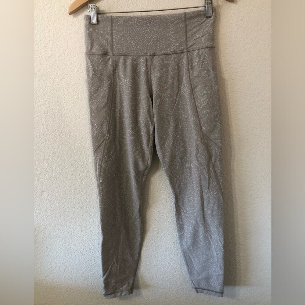 Athleta Salutation Stash Pocket Tight in Quail Tan Beige - Size Medium